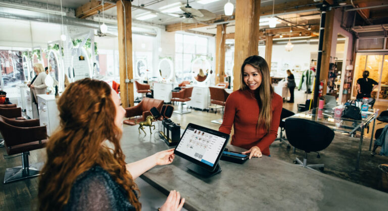 A customer conveniently paying their bill, showcasing the secure transaction capabilities of a restaurant management system.