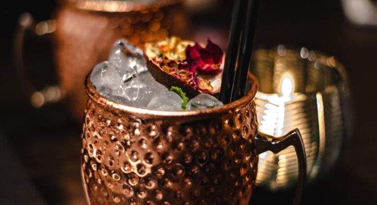 A mug of coffee fueling a detailed review of warehouse management accounting data.