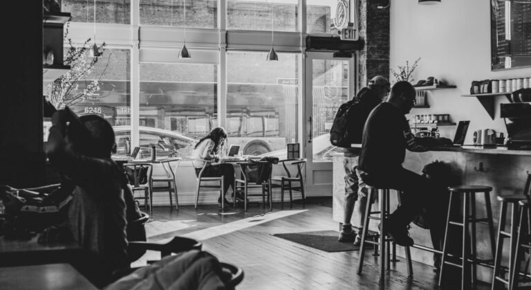 The organized and inviting interior of a smart cafe, a showcase of effective cafe automation.