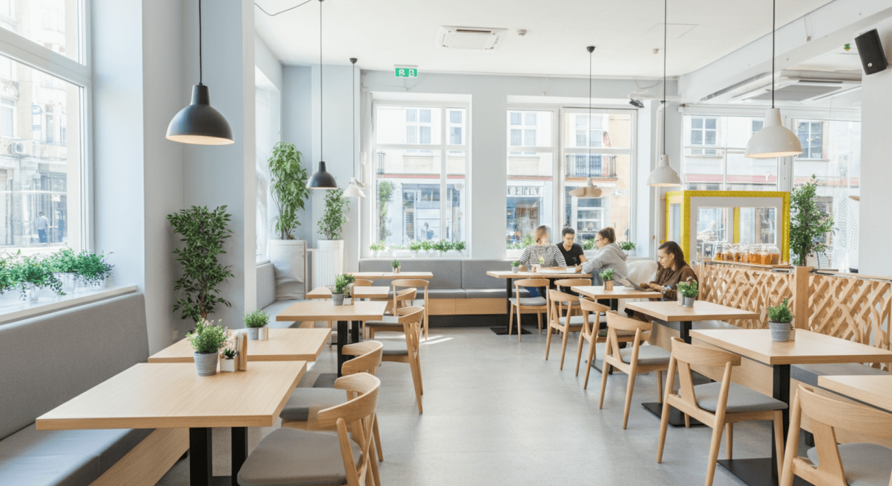 A bustling restaurant full of diners, where a CRM for restaurant business helps manage the guest experience