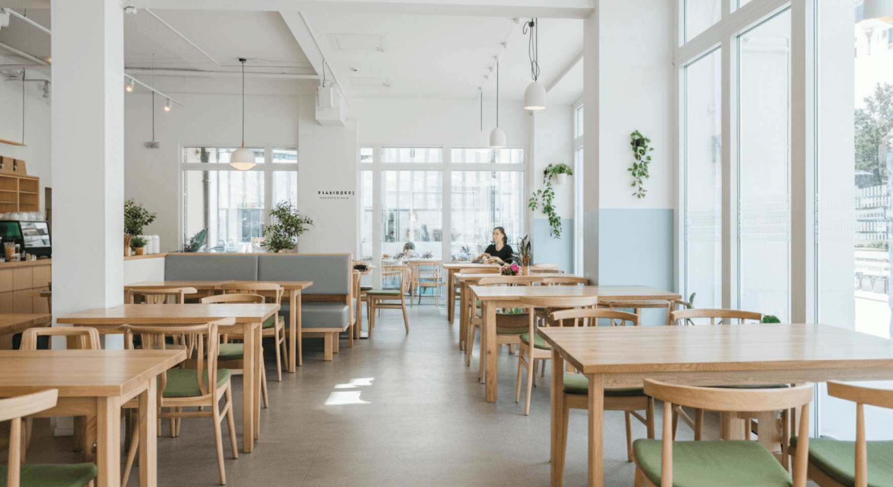 A bustling cafe full of customers, where effective cafe management accounting supports a thriving business