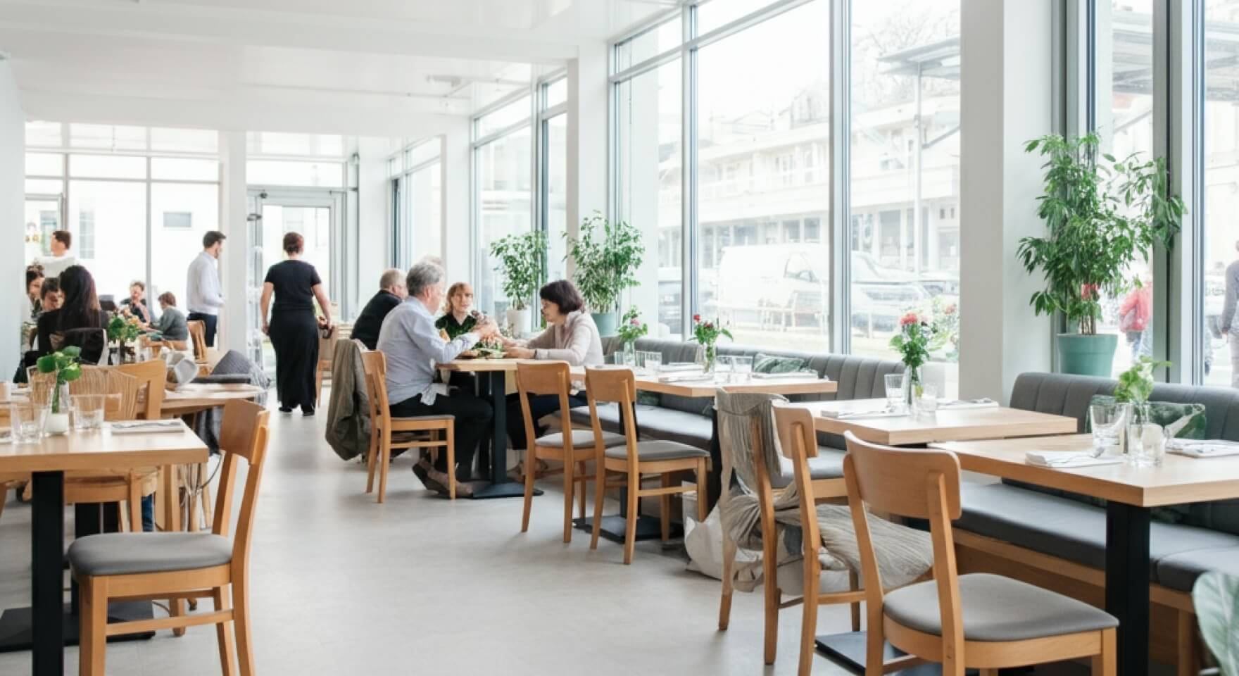 Guests in a lively establishment where accurate bar inventory management helps maintain high service levels